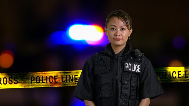Asian American Policewoman smiling at camera