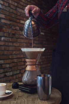 Barista brewing coffee