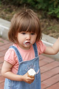 Cute girl with icecream in hand