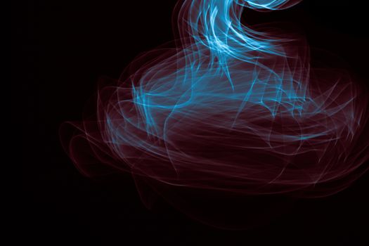 Glowing abstract curved blue and red lines