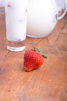 fresh strawberry milk in a glass. close up