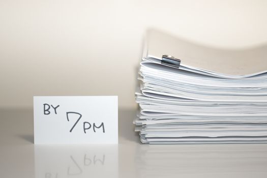 By 7 PM; Stack of Documents on white desk and Background.