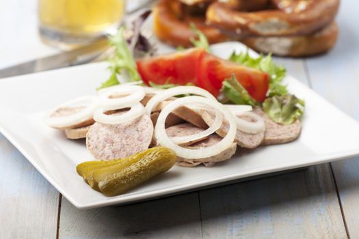 bavarian sausage salad with a pretzel 