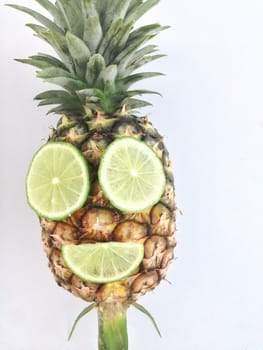 pineapple with mouth and eye made from lime