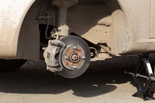 Closeup shot of car's disc brake without wheel on it