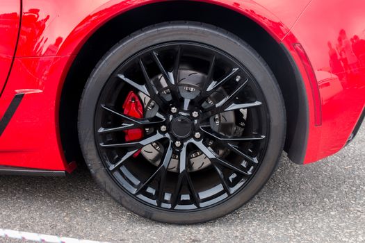 Close up view of a sports car wheel.