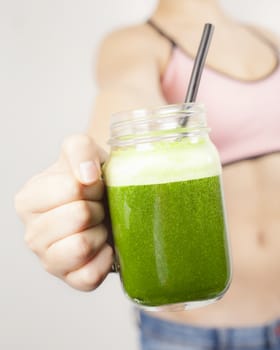 Teenage girl with green smoothie