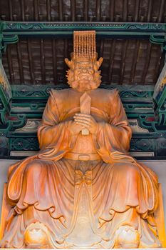 Wooden sculptured Buddhist Diety