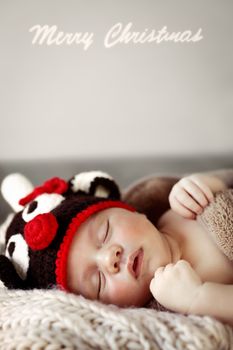 Cute baby sleeping in Christmas costume