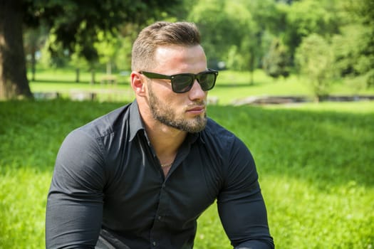 Handsome Muscular Hunk Man Outdoor in City Park