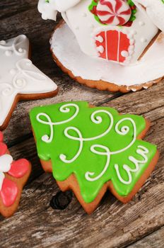 Gingerbread winter Christmas tree on wooden