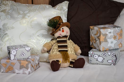 Snowman. Christmas decoration with Christmas toys