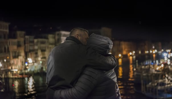 lovers hugging on the Grand canal in Venice