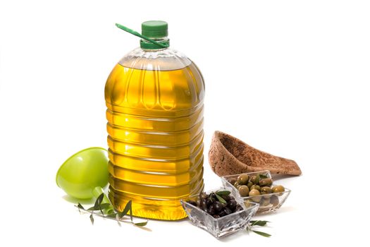 Green and black olives with olive oil bottle isolated on a white background.