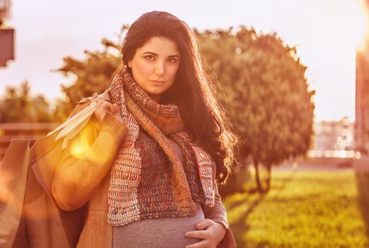 Pregnant woman with shopping bag