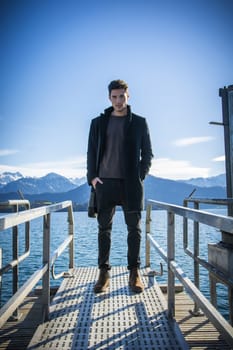Handsome young man on Luzern lake's shore
