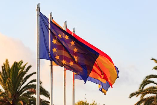 Flags of Spain, Salou, Catalonia, European Union against blue sk