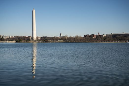 A photograph of the Washington Monument in Washington DC. It was taken on a cold but sunny day in Autumn Fall .