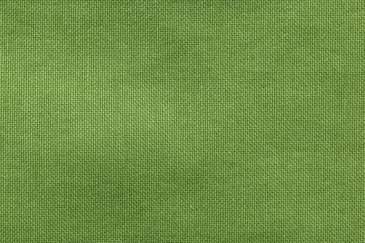 Textured background rough fabric of green olive color.