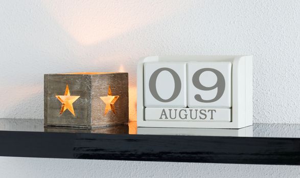 White block calendar present date 9 and month August