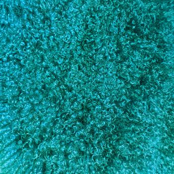 Turquoise colored sheepskin background