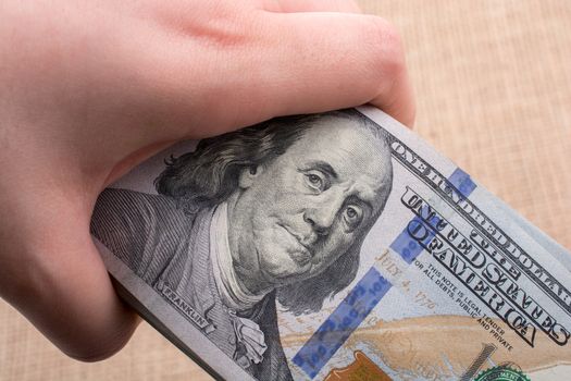 Close up of Benjamin Franklin face on US dollar 