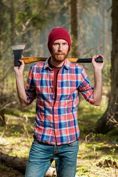 severe bearded forester with an ax vertical portrait in the fore