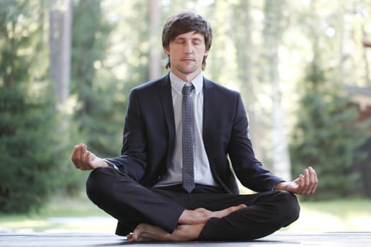 Businessman practicing yoga