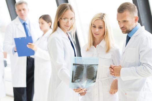 Group of doctors looking at x-ray