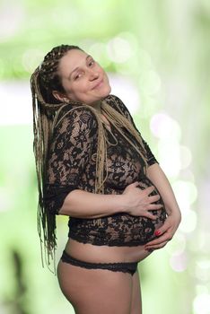 Pregnant Woman Holding Abdomen