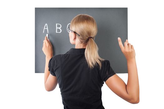 Young teacher near blackboard