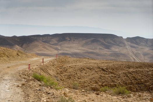 Hiking activity tourism in mountain desert landscape