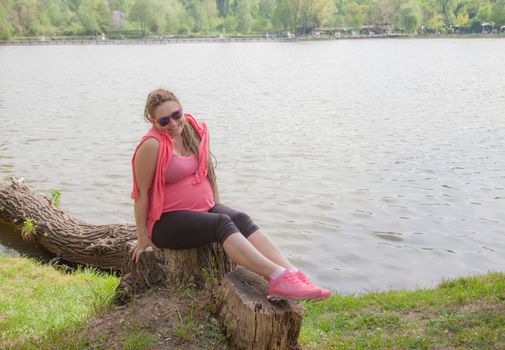 Pregnant Woman Outdoors Smiling Dam
