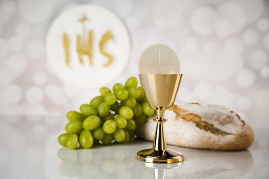 Holy communion a golden chalice, composition isolated on white