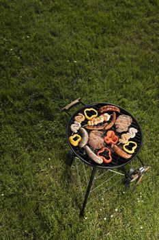 Grill with red hot briquettes, fire background
