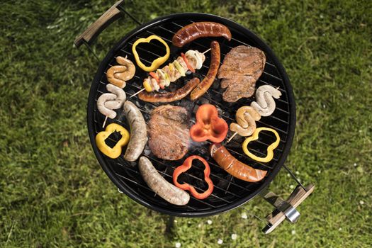 Grill with red hot briquettes, fire background