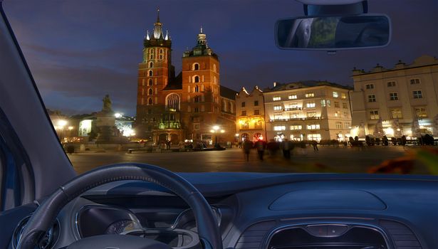 Car windshield with view of Market Square, Krakow, Poland