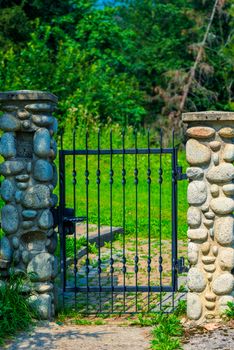 architectural element - wrought iron wicket and pillars trimmed 