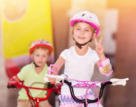Happy children on bicycles