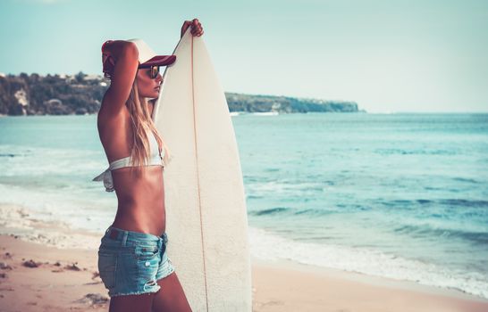Sportive woman with surfboard