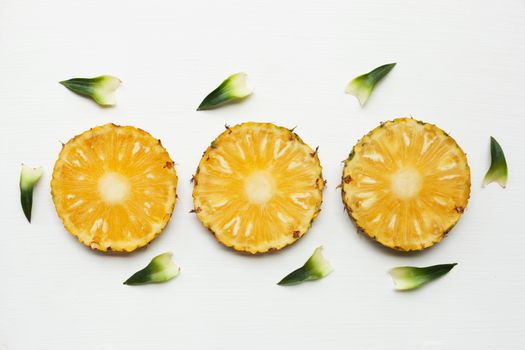 Slices of pineapple isolated on white.
