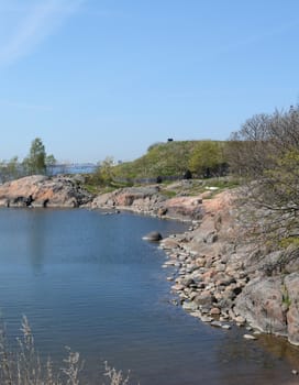 Suomenlinna beach and rocky cove on a sunny day
