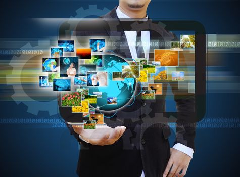 businessman holding Reaching images streaming in hands .Financia