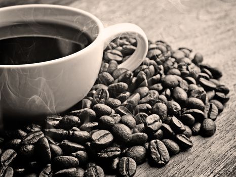 black and white coffee on grunge wooden background