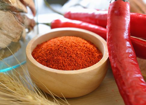 Cayenne pepper in wood bowl 