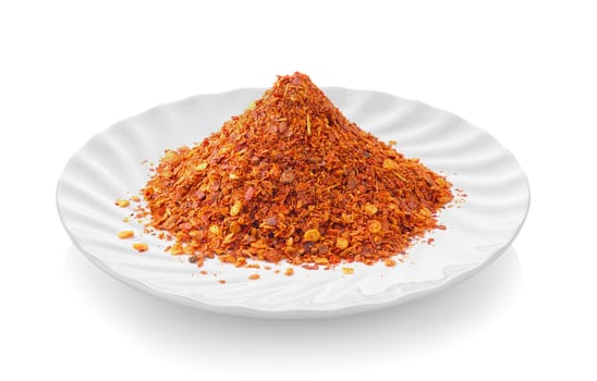 Cayenne pepper in a plate on white background