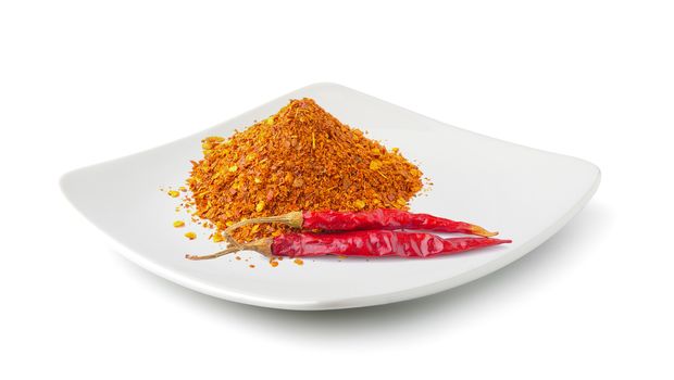 Cayenne pepper in a plate isolated on white background