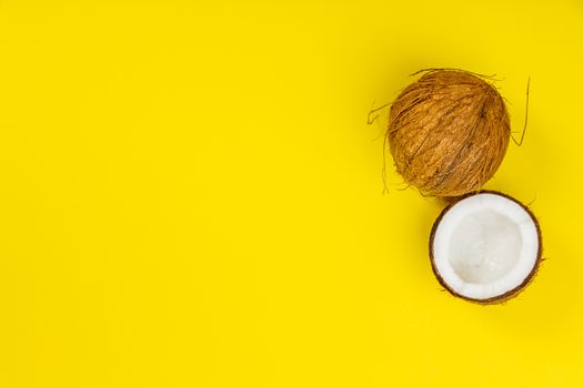 Coconuts on yellow background