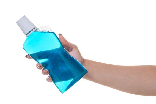 bottle with rinse aid for mouth in hand 