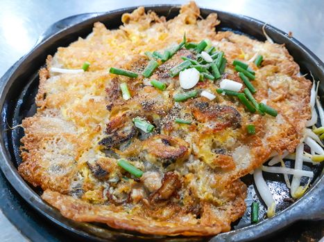 Deep fried mussel on hot pan ,Thai food.